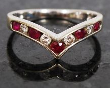 An 18ct gold ladies half eternity ring set with ruby and diamonds being channel set with