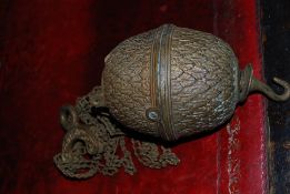 A Victorian brass rise and fall light fixture in the forn of an acorn.