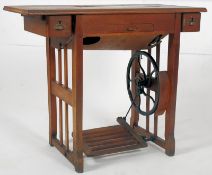 A late Victorian Arts & Crafts Treddle sewing machine table. Arts & Crafts style with peddle to