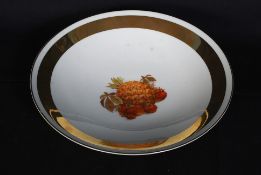 A 1940`s Bavarian hand painted charger plate with gilt borders and floral decoration. 33cm.