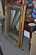 A large antique style regency gilt wood mirror. Rococo form with large bevelled glass. 99cm x