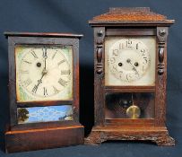 A 19th century American ginger bread clock with key and pendulum together with another.