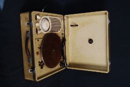 A 1940`s / 1950`s portable Alba radiogram with manual winder or mains.