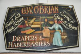 A 20th century hand painted large  wooden advertising / shop display sign for Drapers and