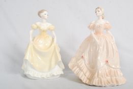 Two Coalport figurines of Emily and Louisa. Tallest 22cm.