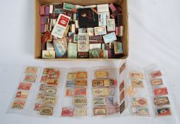 A large quantity of vintage matchboxes, covers and cigarette packets etc