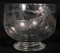 An etched lead crystal tea bowl with balloon and ribbon etched design to surface.