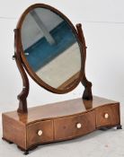 An antique Georgian 19th century flame mahogany toilet swing mirror. Serpentine base inlaid to
