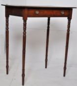 A 19th century Georgian mahogany and oak writing table. The tall tapering turned legs supporting a