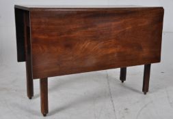 A 19th Georgian cuban solid mahogany drop leaf dining table. Square legs with gate action to