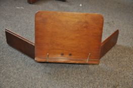 An Edwardian table top music stand marked John Watts.