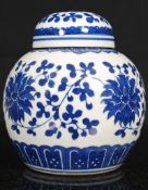 A small 20th century  blue and white glazed Chinese ginger jar having domed lid atop