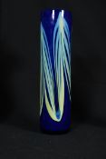 A retro 1970`s coloured glass vase of blue cylindrical form having drip glaze decoration