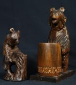 Two black forest style carved wooden bears. Tallest being 27cm.