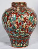 A late 18th / early 19th century Chinese bulbous oriental vase decorated with a scene of numerous