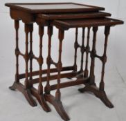 Edwardian style mahogany nest of occasional tables. The turned legs united by stretchers supporting