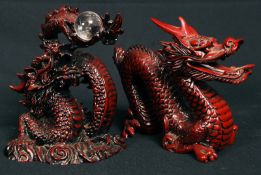 Two Chinese resin dragons.