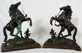 A pair of French bronze models of the Marley horses, AFTER GUILLAUME COUSTOU (FRENCH 1677-1746)