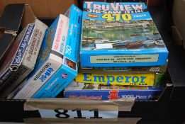 A box of vintage and 20th century jigsaw puzzles to include wooden examples, Waddingtons and others