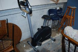 A Reebok electronic exercise bike having pulse monitor, computer with adjustable settings and