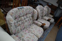 A dark stained beech wood and tapestry upholstered 3 piece cottage suite  to include a 2 seat sofa