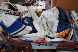 A good set of Motorbike racing leathers in two tone blue and white with advertising patches. Size 50