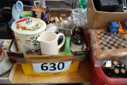 A vintage kitchen mincer, wooden cruet set, military jug, lemon squeezers, etc