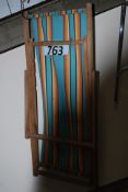 A retro 1970's folding deck chair with canvas centre.