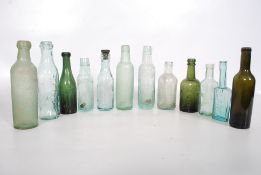 A collection of 19th century and later glass bottles to include Watsons of Cowdenbeath, Bown & Co