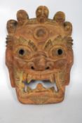 A large 19th century Victorian Chinese ceremonial mask of wooden construction bearing some of the