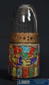 A decorative enamelled copper oil lamp with glass dome top. depicting nature animal scene.