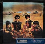 Music Memorabilia. An unframed `Motley Crew ?` music album poster. Overall 59cms High x 59cms Wide.