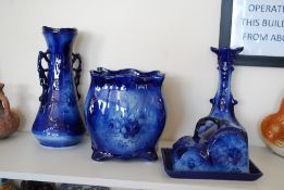 4 pieces of Staffordshire Flow Blue china to include cheese dish, planter, and two vases. Tallest