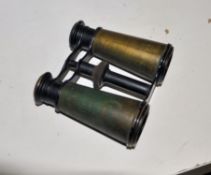 An early pair of Herwitz`s binoculars with brass decoration and impressed fly/wasp marking to