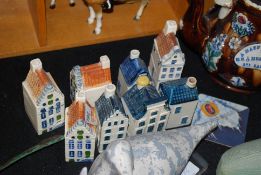 A collection of 6 decorative china KLM Bols Dutch Delft cottage buildings. 13cm tall.