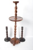 A pair of oak barley twit candle sticks, barley twist ashtray along with a bakelite lamp.