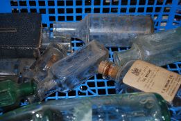 A collection of vintage glass bottles to include hand blown, mineral bottles etc