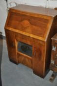 A 1930`s Art Deco burr walnut bureau converted to a radiogram cabinet. The internal area re-
