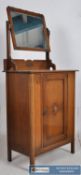A 1920`s oak hallway cabinet / dresser. The square legs supporting an upright cabinet with central
