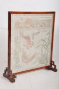 An early 20th century mahogany framed Chinese / Oriental framed firescreen. Decorative inset design