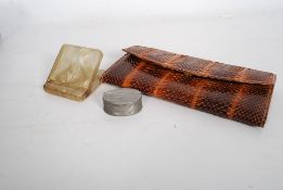 A 20th century snake skin ladies purse together with a 1930`s Art Deco celluloid cigarette case