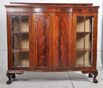 A 1930`s Art Deco mahogany bookcase display cabinet. The ball and claw feet supporting a large size