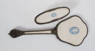 A Wedgwood jasperware cameo inset clothes brush and mirror. Decorative fret metal design with inset