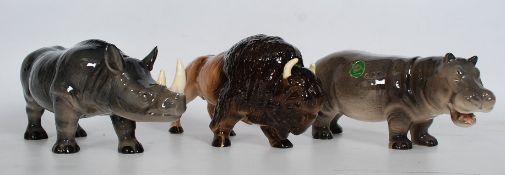 A collection of Melba Ware china zoo animals to include a Rhino, Buffalo and a Hippo. Longest being