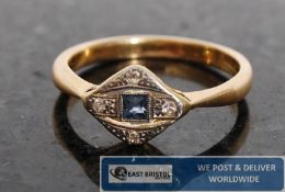 A 1920`s / 1930`s Art Deco sapphire and diamond solitaire ring. The plain 18ct gold hoop mounted