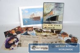A small quantity of Titanic ephemera to include a tin sign, James Cameron Book, reproduction
