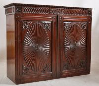 An early 19th Century Anglo Indian rosewood bookcase cabinet. of Regency design with gadrooned