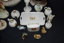 A small quantity of motto crested ware, along with several Wade whimsies.