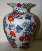 A mid 20th century large Chinese famille rose decorated vase. The bulbous body with waisted neck