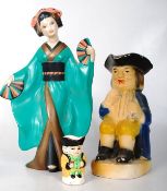 A fairground prize 1930`s plaster toby jug figurine together with a smaller toby jug and a plaster